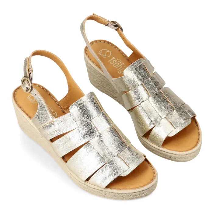 A pair of metallic silver woven-look wedge sandals with espadrille-look soles, shown on a clean white background.