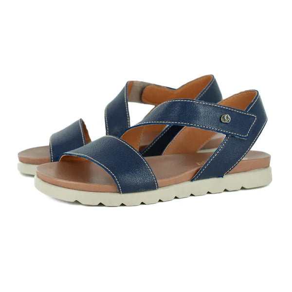 Pair of blue sandals with off white  soles on a white background