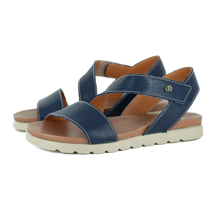 Pair of blue sandals with off white  soles on a white background