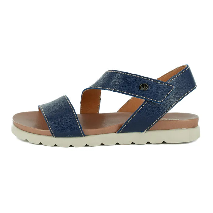 Blue sandal with an off white sole on a white background