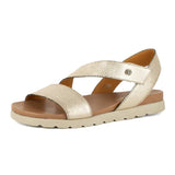 Gold sandal with a off white sole on a white background