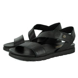 Black sandals with criss-cross straps on a white background
