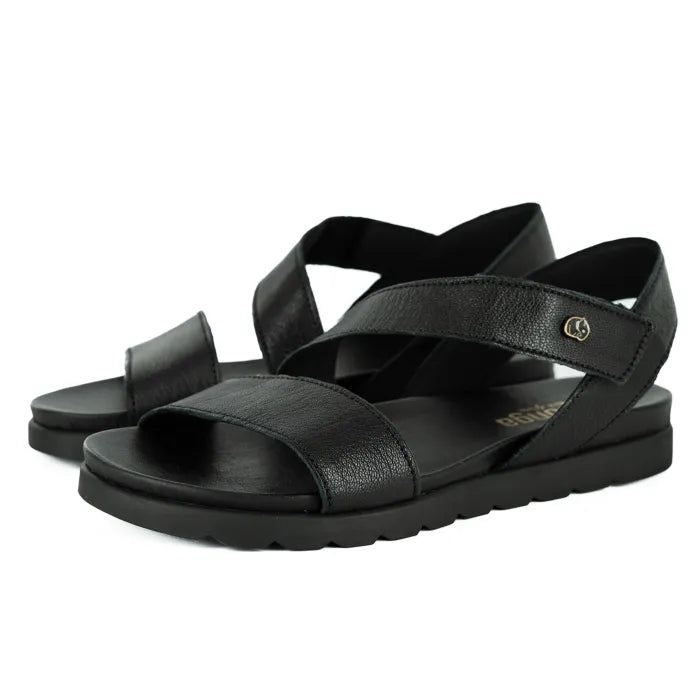 Black sandals with criss-cross straps on a white background