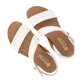 White sandals with off white soles on a white background