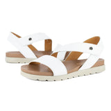White sandals with off white soles on a white background