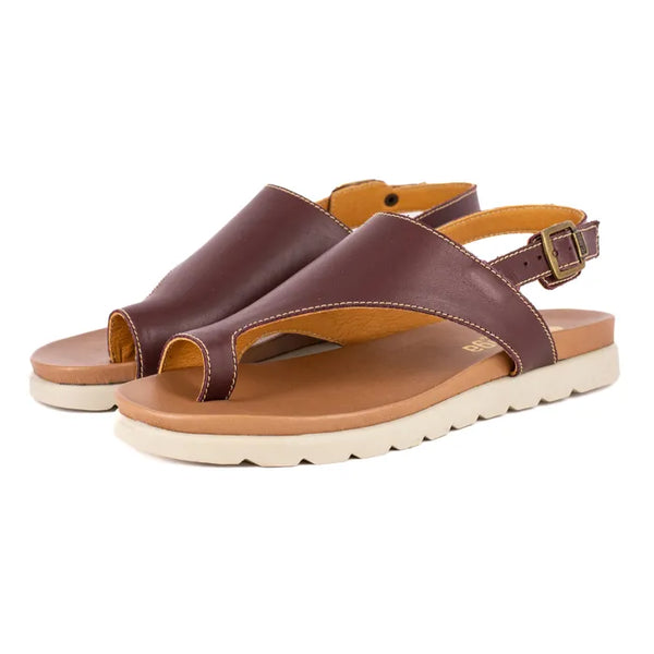Brown sandals with a white sole on a white background