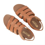 Pair of tan sandals with 'Tsonga' branding on a white background