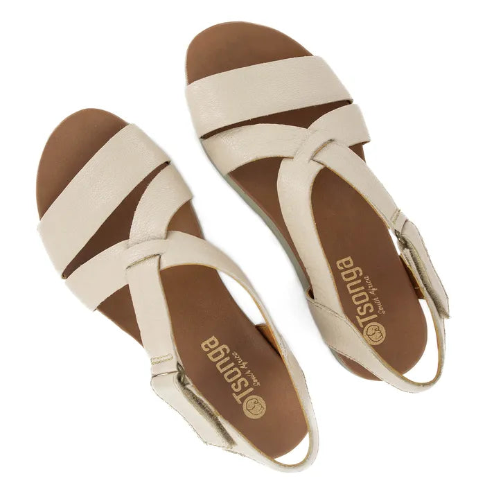 Pair of beige sandals with off-white soles on a white background