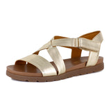 Gold sandal with a tan sole on a white background