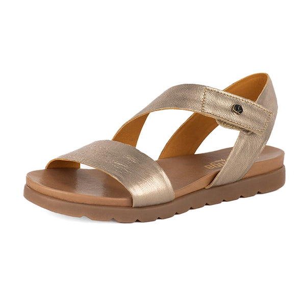 Gold sandal with a brown sole on a white background
