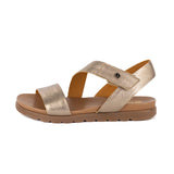 Gold sandal with a brown sole on a white background
