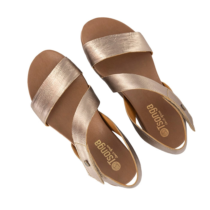 Pair of gold sandals on a white background