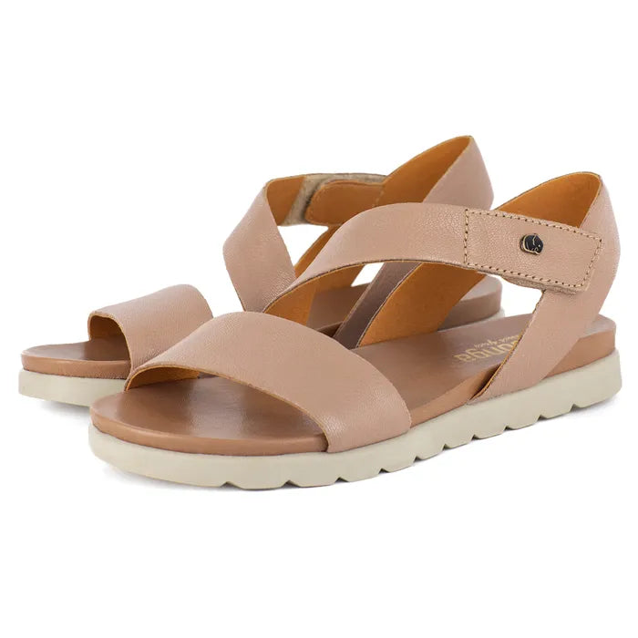 Pair of beige sandals with criss-cross straps on a white background
