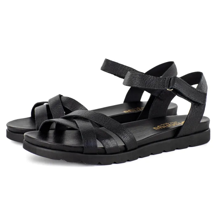 Black sandals with multiple straps on a white background