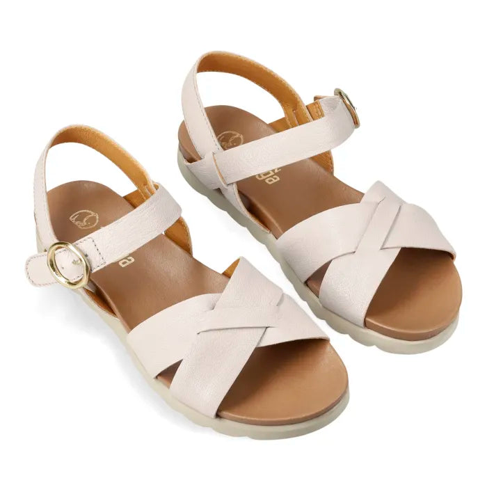 A pair of women's flat sandals with wide criss-cross front straps, ankle straps with gold-tone buckles, and tan footbeds, shown on a plain white background.