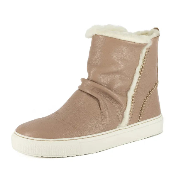 Beige winter boot with white fur lining on a white background