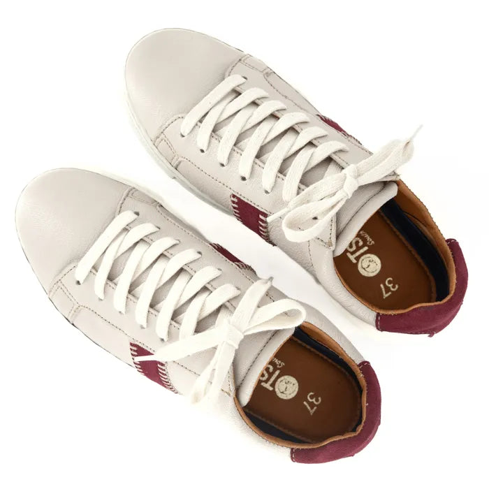 Pair of sneakers with white laces on a white background