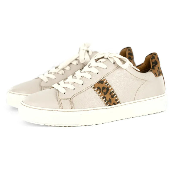Cream sneakers with leopard print accents on a white background