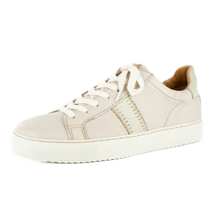 Cream sneaker with tan lining on a white background