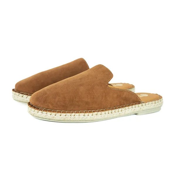 Pair of brown suede slip-ons with white soles on a white background