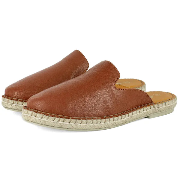 Pair of brown leather espadrille mule on a white background