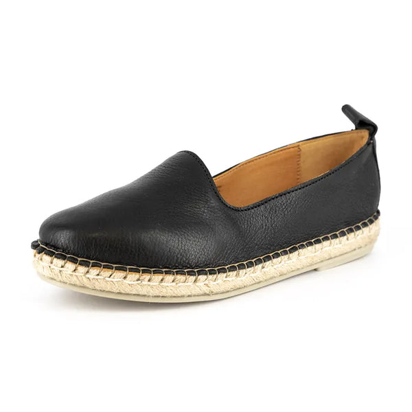 Black leather espadrille shoe on a white background