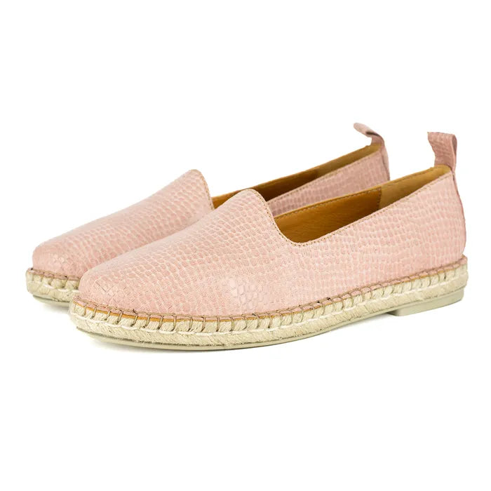 Pair of pink espadrilles on a white background