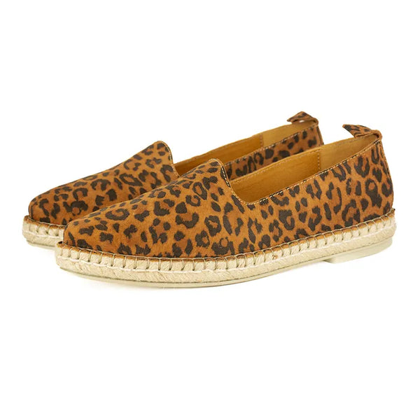 Pair of leopard print espadrilles on a white background