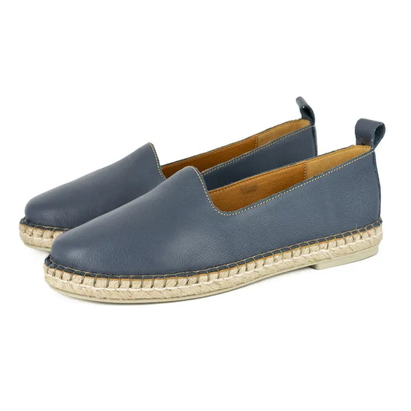 Pair of blue espadrilles on a white background