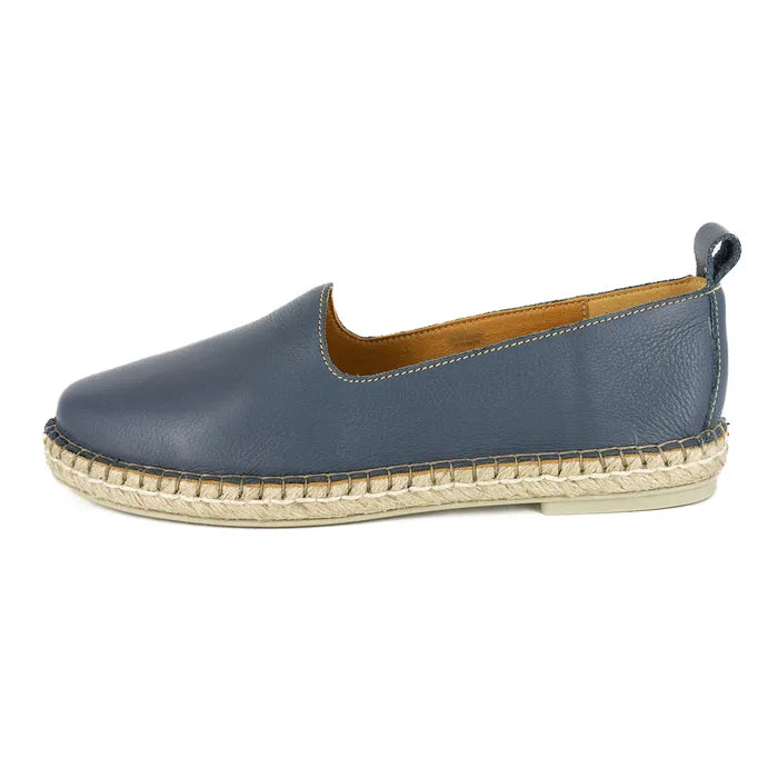 Blue espadrille shoe with jute sole on a white background