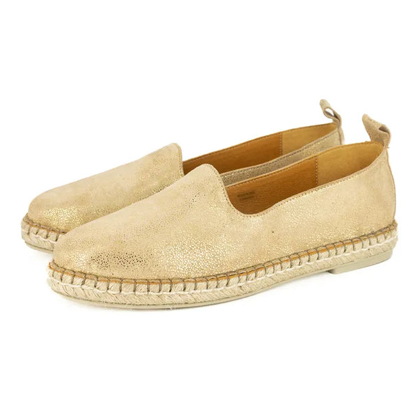 Pair of gold espadrilles on a white background