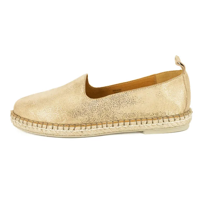 Gold espadrille shoe on a white background