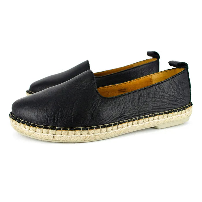 Black leather espadrilles on a white background