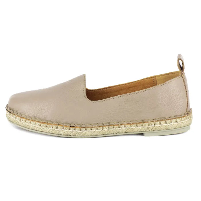 Beige espadrille shoe on a white background