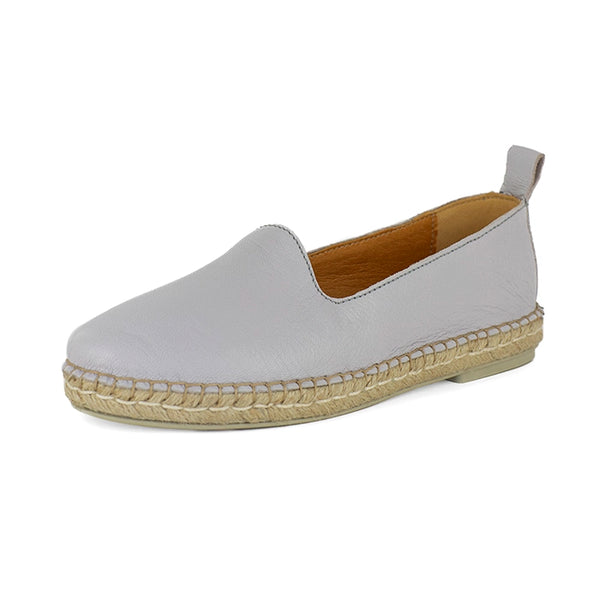 Light grey espadrille shoe with beige soles on a white background
