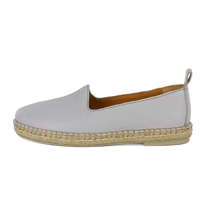 Light grey espadrille shoe with beige soles on a white background