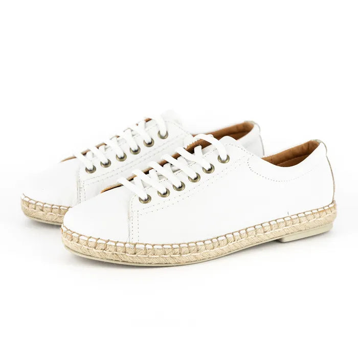 White sneakers with woven sole on a white background
