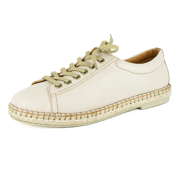Beige espadrille shoe with jute sole on a white background