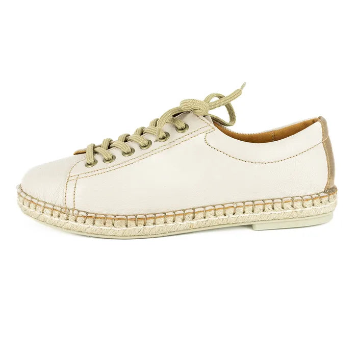 Cream sneaker with beige sole on a white background