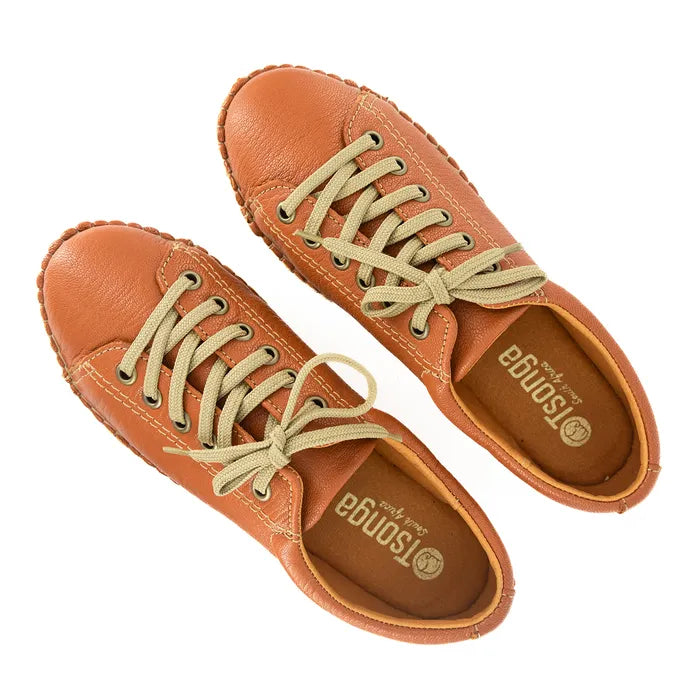 Pair of tan leather shoes with beige laces on a white background