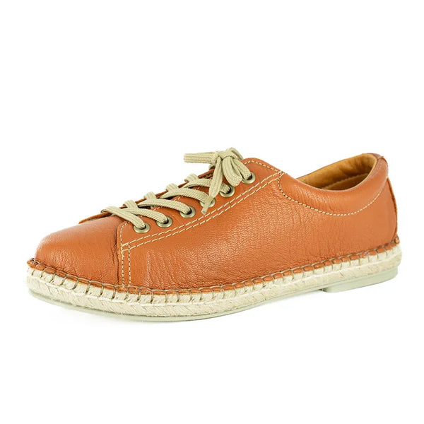 Brown leather shoe with beige laces on a white background