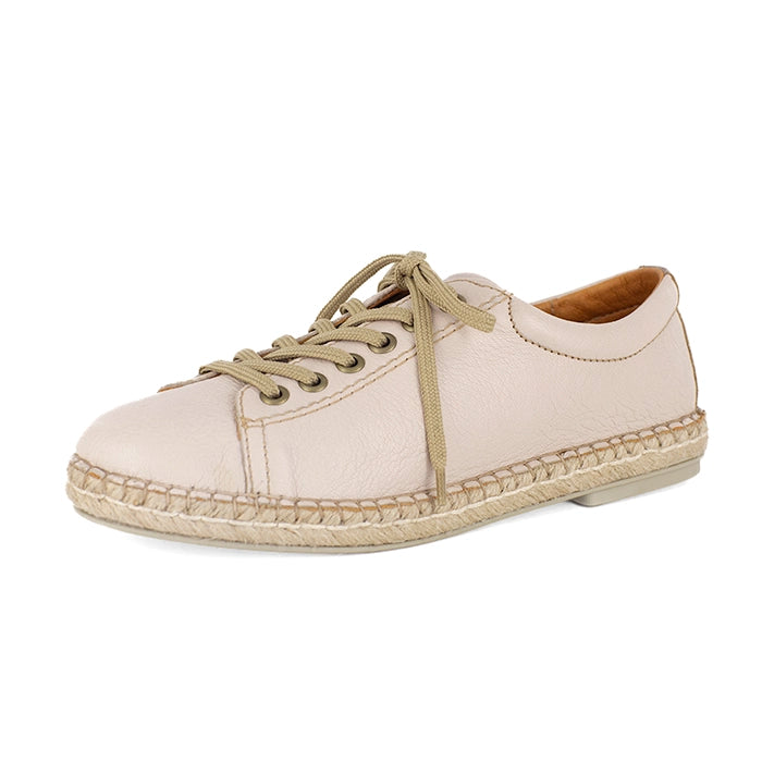 Beige espadrille shoe on a white background