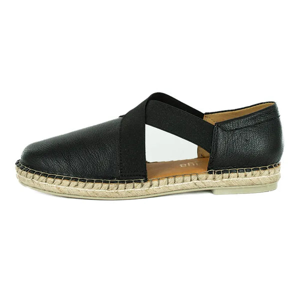 Black shoe with espadrille sole on a white background