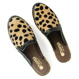 Pair of leopard print mules with 'Tsonga' branding on a white background