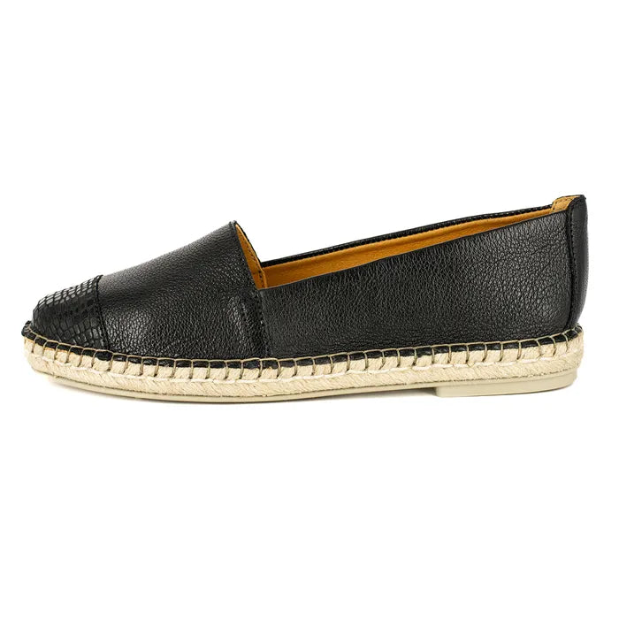 Black leather espadrille shoe on a white background