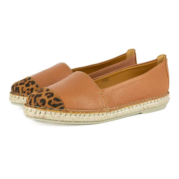 Pair of brown espadrilles with leopard print accents on a white background
