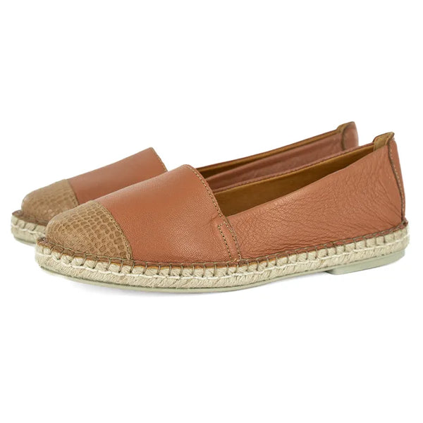 Pair of brown espadrilles on a white background