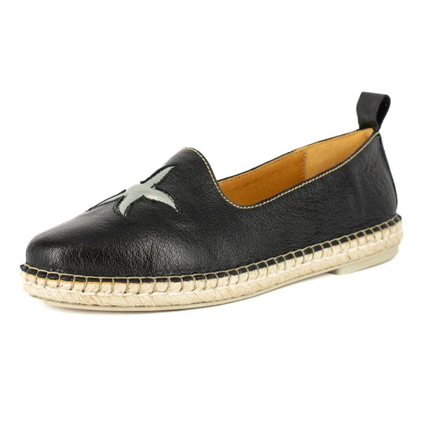 Black leather espadrille shoe with star detail on a white background