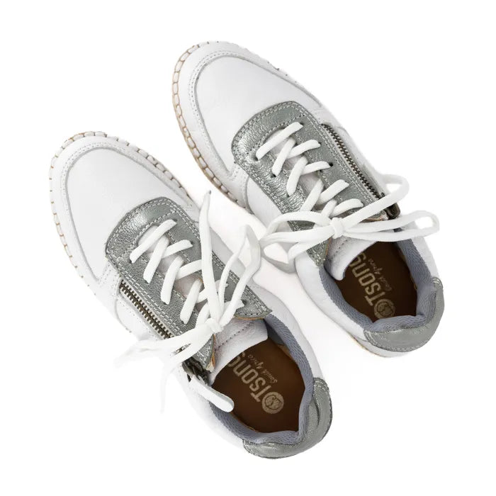 White sneakers with silver accents and white laces on a white background