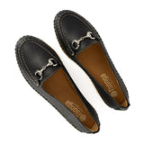 Pair of black loafers with a metallic buckle on a white background